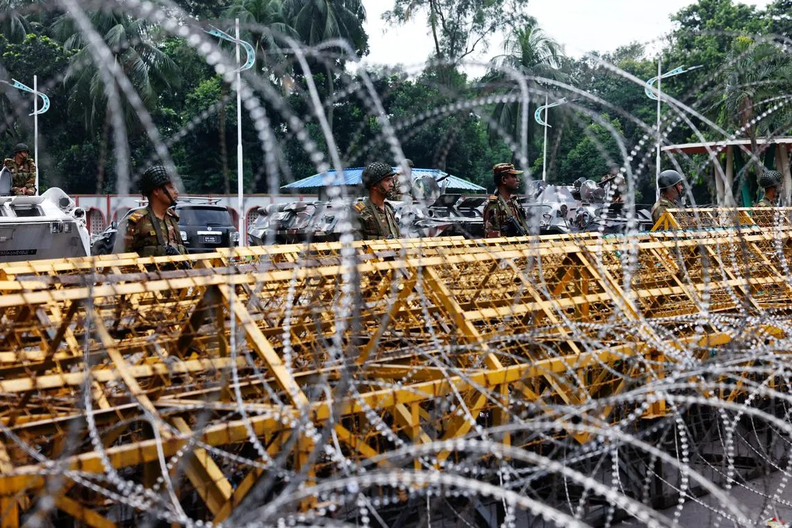 Security personnel stand guard in front of the Bangabhaban, the residence and workplace of President Mohammed Shahabuddin after protesters demanded the resignation of Shahabuddin in Dhaka, Bangladesh, October 23, 2024. REUTERS/Mohammad Ponir Hossain