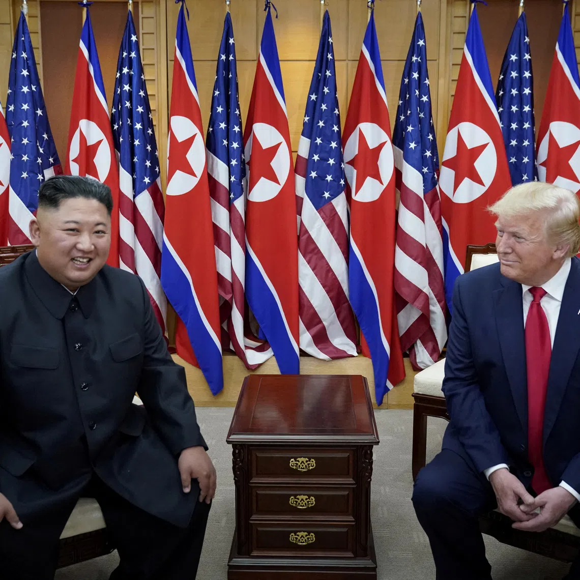 FILE PHOTO: U.S. President Donald Trump meets with North Korean leader Kim Jong Un at the demilitarized zone separating the two Koreas, in Panmunjom, South Korea, June 30, 2019. REUTERS/Kevin Lamarque/File Photo