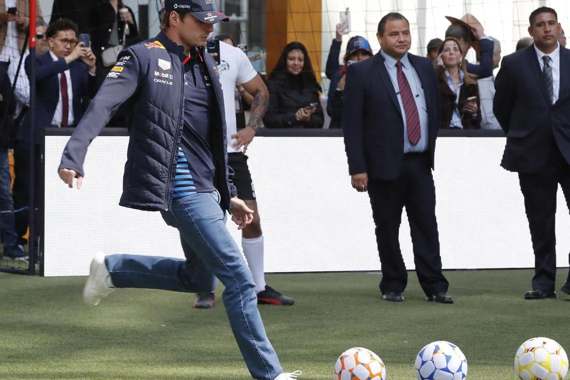 Max Verstappen kicks a ball during a press conference in Mexico City, ahead of the Mexican Grand Prix.