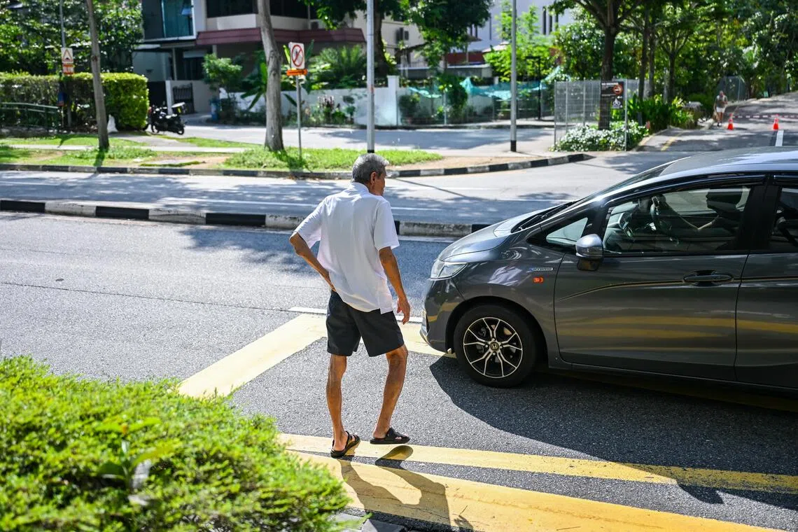An elderly man jaywalking along Irrawaddy Road in May. In 2025, there were 15 fatal accidents involving elderly pedestrians who jaywalked.