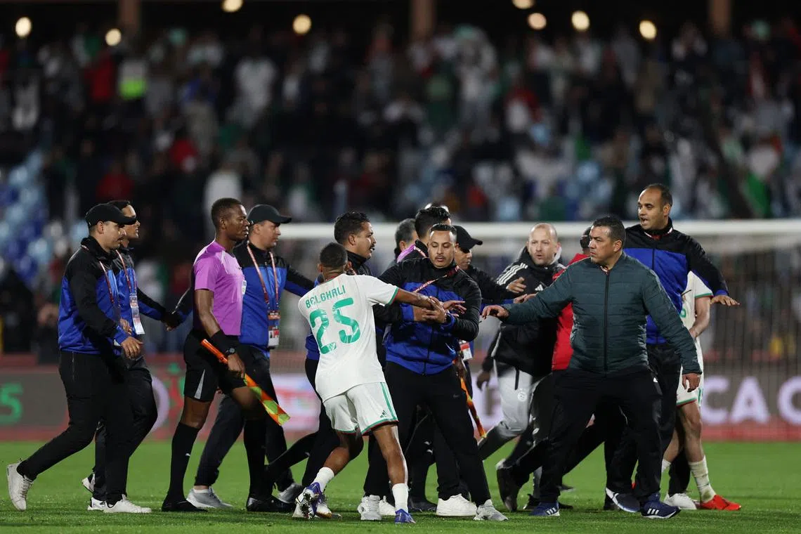 Soccer Football - CAF Africa Cup of Nations - Morocco 2025 - Quarter Final - Algeria v Nigeria - Grand Stadium of Marrakech, Marrakesh, Morocco - January 10, 2026 Algeria's Rafik Belghali clashes with match officials after the match REUTERS/Amr Abdallah Dalsh