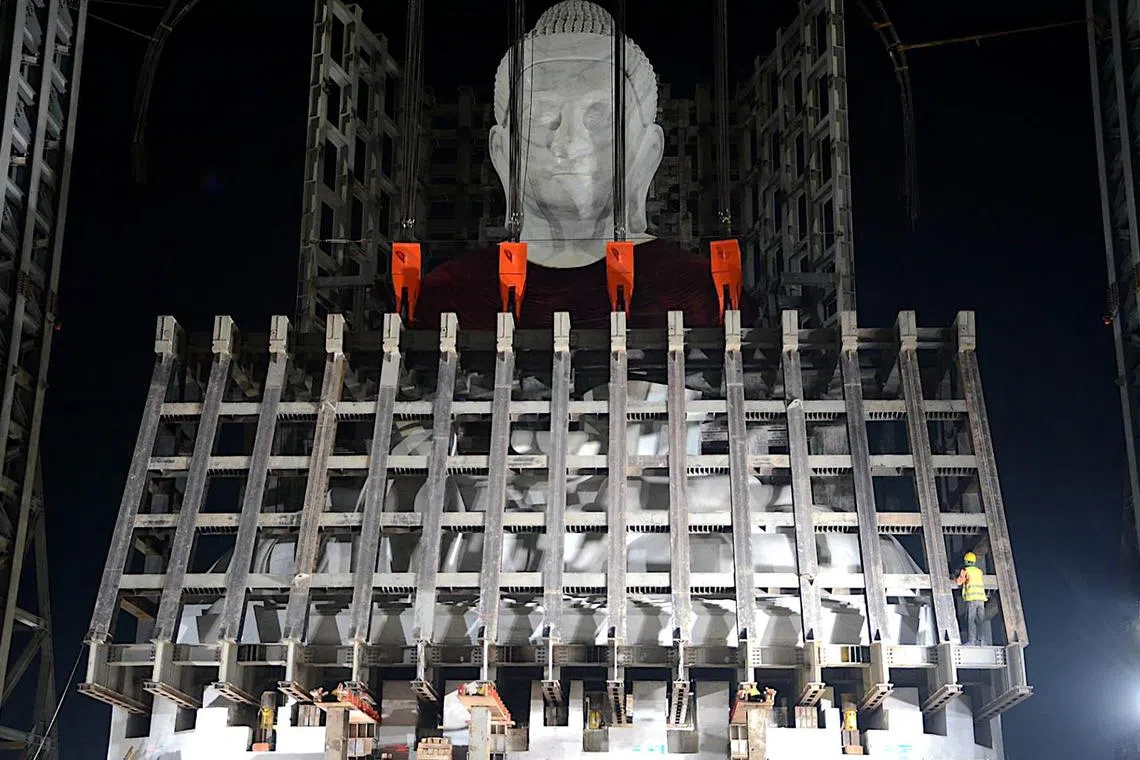 A handout photo from the Myanmar junta's information team taken and released on Feb 13, 2023, shows construction of the Maravijaya Buddha statue in Naypyidaw, which state media claims will be the world's largest marble statue of the Buddha when it is completed. 
