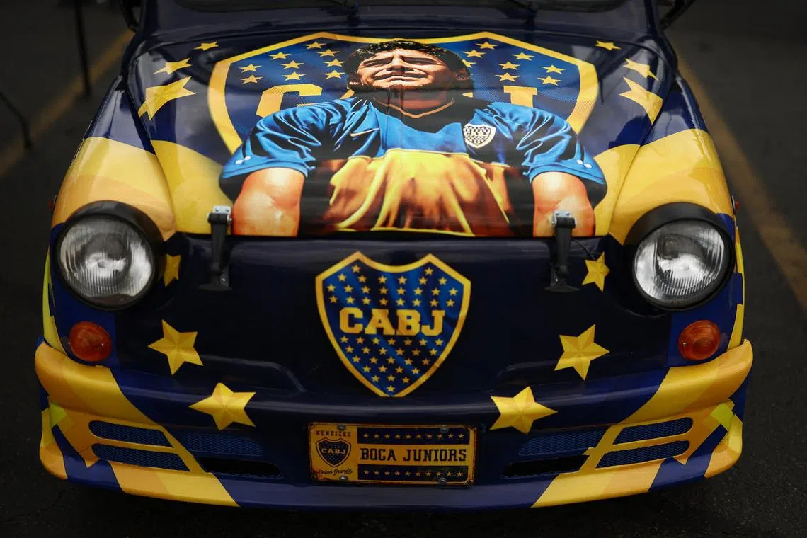 Soccer Football - FIFA Club World Cup - Final - Chelsea v Paris St Germain - MetLife Stadium, East Rutherford, New Jersey, U.S. - July 13, 2025 A car decorated in the colours of Boca Juniors and featuring an image of Diego Maradona is seen outside the stadium before the match REUTERS/Lee Smith