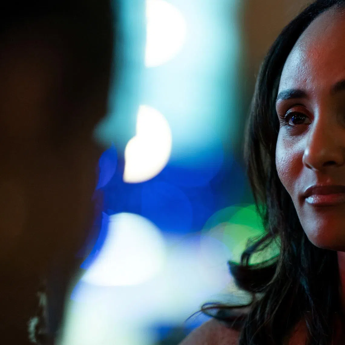 Melat Kiros, Democratic candidate for the U.S. House of Representatives from Colorado's 1st Congressional District, meets with members of Washington, D.C.'s Ethiopian diaspora during an event at Punch Bowl Social in Arlington, Virginia, U.S., March 15, 2026. REUTERS/Elizabeth Frantz