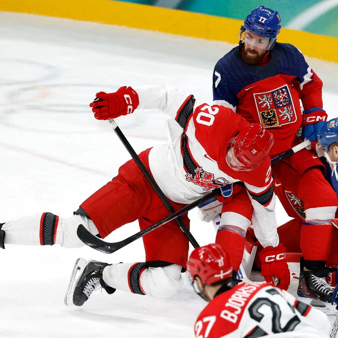 Milano Cortina 2026 Olympics - Ice Hockey - Men's Qualification Play-off - Czech Republic vs Denmark - Milano Santagiulia Ice Hockey Arena, Milan, Italy - February 17, 2026. Lars Eller of Denmark in action with Filip Hronek of Czech Republic and Ondrej Kase of Czech Republic during the match REUTERS/David W Cerny