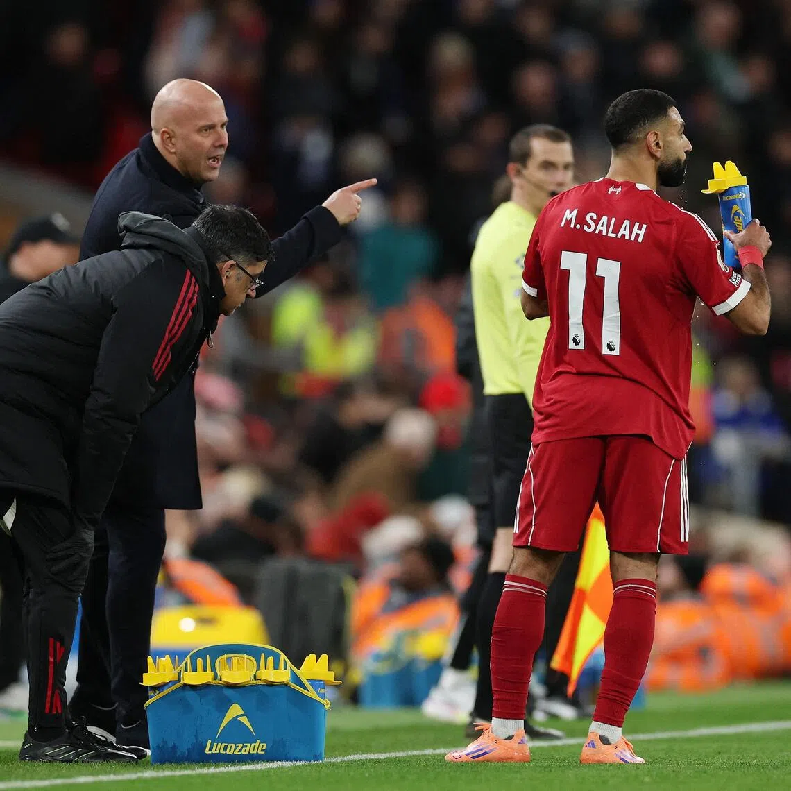 Liverpool's Mohamed Salah during a break in play as manager Arne Slot looks on in their 2-0 win over Brighton & Hove Albion on Dec 13.