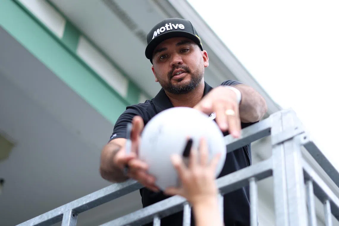 Jun 9, 2025; Oakmont, Pennsylvania, USA; Jason Day signs an autograph during a practice round for the U.S. Open golf tournament at Oakmont Country Club. Mandatory Credit: Bill Streicher-Imagn Images