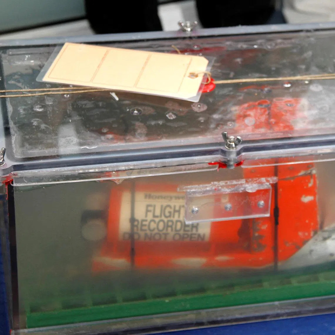 FILE PHOTO: The Cockpit Voice Recorder (CVR), one of two flight recorders from the Rio-Paris Air France flight which crashed in 2009, is carrying to be displayed for the media before a news conference at the BEA headquarters in Le Bourget, northern Paris, May 12, 2011.  REUTERS/Charles Platiau/File Photo