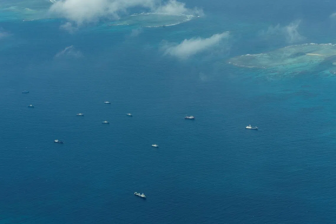 An aerial view of what Philippine Coast Guard alleges were Chinese vessels, manned by Chinese maritime militia loitering within the vicinity of Thitu Island, one of nine features occupied by the Philippines in Spratly Islands, in the disputed South China Sea, March 9, 2023/ File Photo