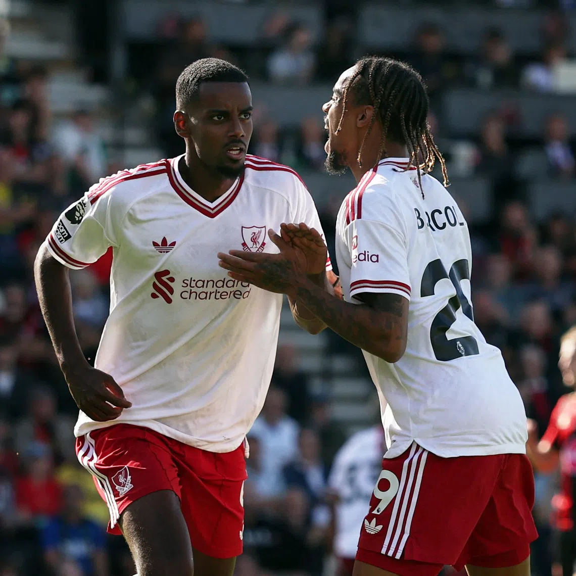 Liverpool’s Alexander Isak (left) celebrates scoring their first goal against Bournemouth with teammate Bradley Barcola.