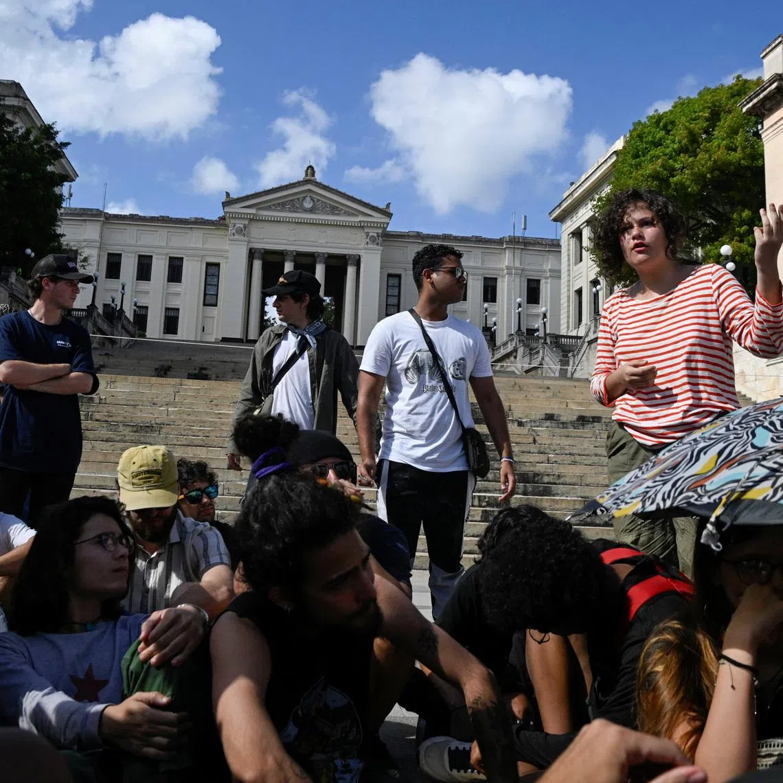 Anabel Oliva, 20, speaks outside the University of Havana during a protest against class disruptions amid energy and internet shortages, in Havana, Cuba, March 9, 2026. REUTERS/Norlys Perez
