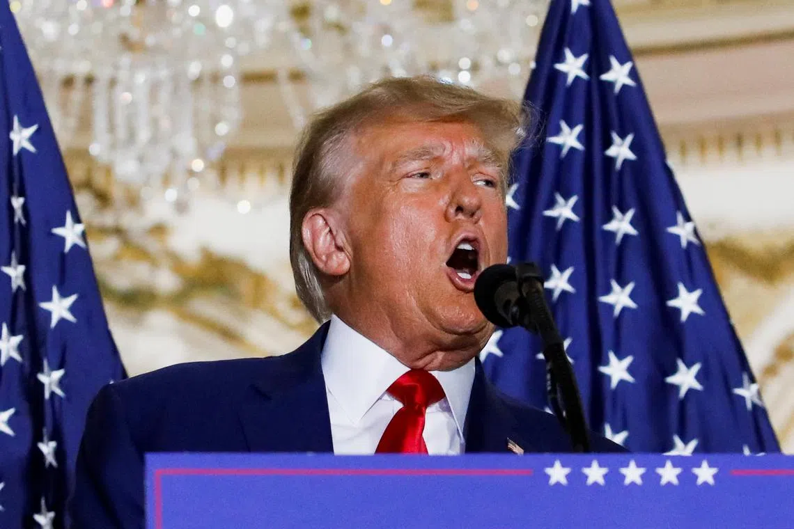 Former U.S. President Donald Trump delivers remarks on the day of his court appearance in New York after being indicted by a Manhattan grand jury following a probe into hush money paid to porn star Stormy Daniels, in Palm Beach, Florida, U.S., April 4, 2023. REUTERS/Marco Bello