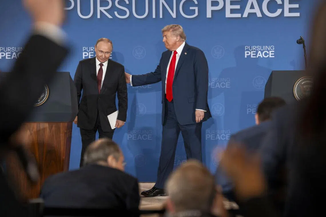 Russian President Vladimir Putin and President Donald Trump begin to leave the stage after making statements in Anchorage, Alaska, on Aug 15, 2025.