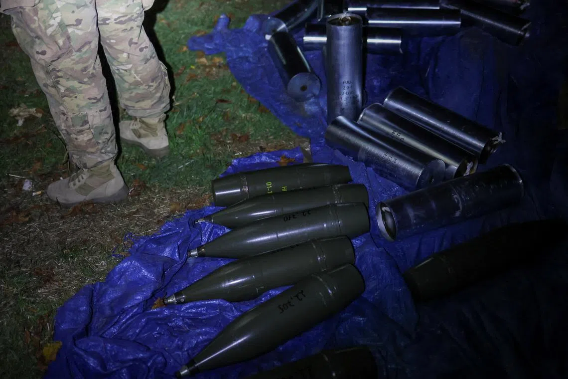 FILE PHOTO: A Ukrainian serviceman stands next to artillery shells at his position in a front line, amid Russia's attack on Ukraine, in an undisclosed location in Southern Ukraine October 25, 2024. REUTERS/Ivan Antypenko/File Photo