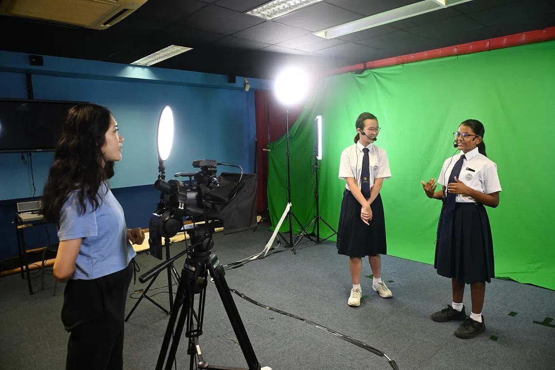 Kuo Chuan Presbyterian Secondary School teacher Mitchelle Ang with Secondary 2 students Clara Ong and Alisha Daniel. Both girls joined the school via Public Speaking as a DSA talent area. 