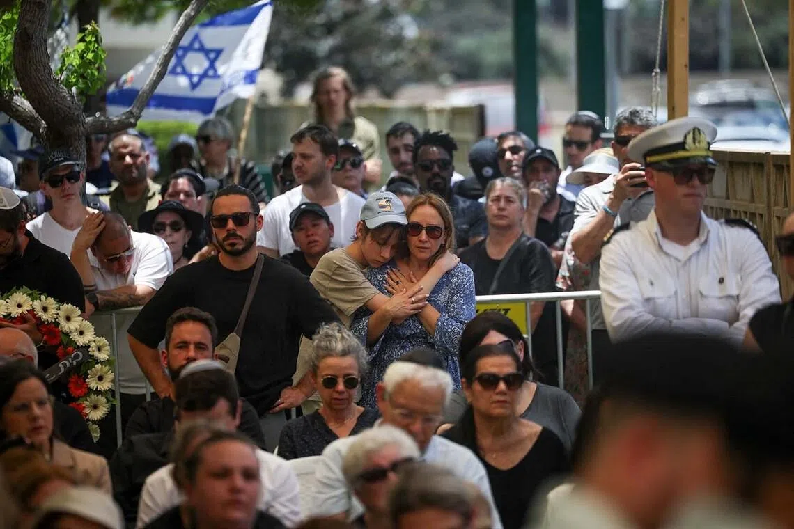 Mourners attending the funeral of Israeli soldier Master Sergeant Alexander Filin, in Haifa, Israel, on June 21. According to the Israeli army, he was wounded and later died in an explosive attack by Hezbollah in southern Lebanon.