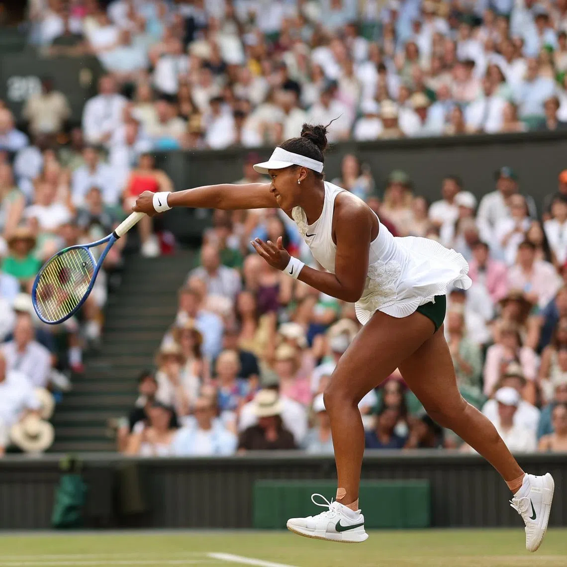 Naomi Osaka serves against Aryna Sabalenka on day seven of Wimbledon 2026.