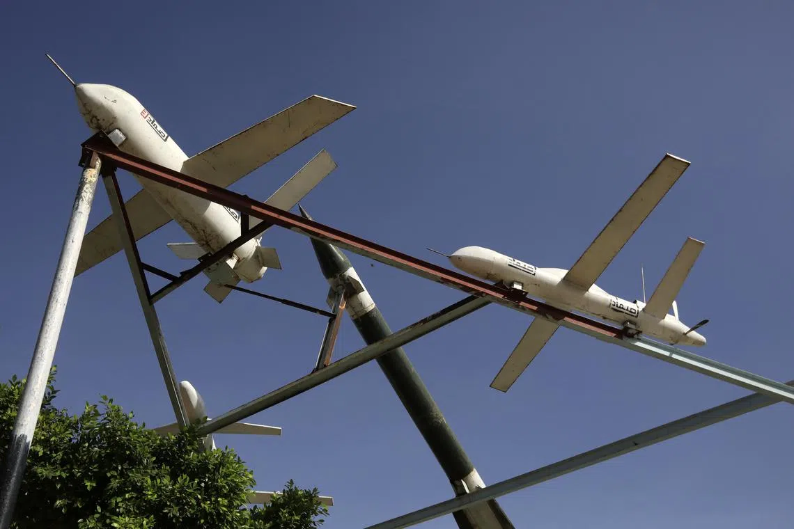 Mock Houthis-made drones and missile are on display at a square in Sana'a, Yemen.