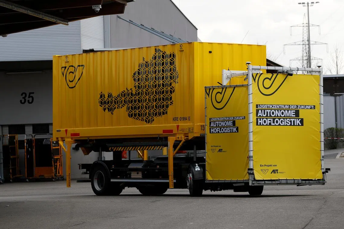 FILE PHOTO: A self-driving mail truck is seen during its presentation at the Austrian Post logistics centre in Vienna, Austria March 26, 2019.  REUTERS/Leonhard Foeger/File Photo