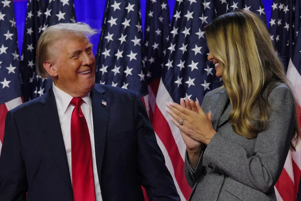 US president-elect Donald Trump is joined onstage by his wife Melania at his election night rally at the Palm Beach County Convention Center in West Palm Beach, Florida, on Nov 6, 2024. 