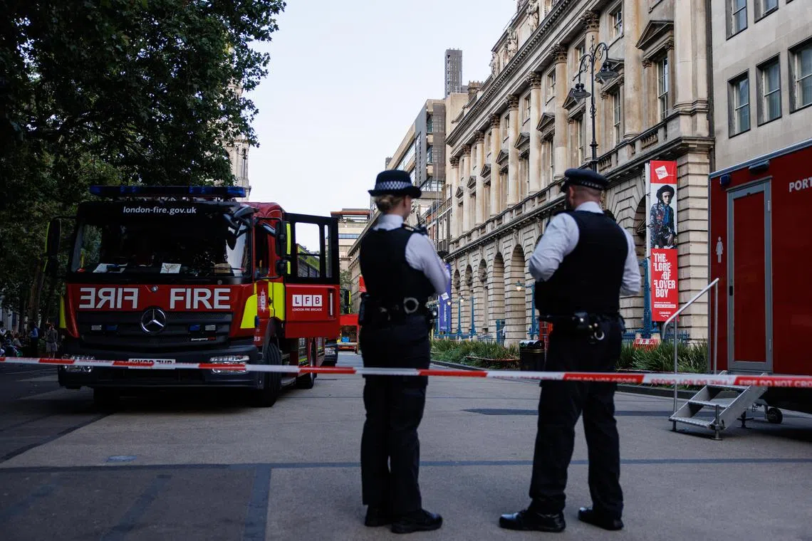 epa11553339 Police officers and firefighters attend a fire on the roof of Somerset House in London, Britain, 17 August 2024. London Fire Brigade (LFB) attended the scene with 125 firefighters and 20 fire engines to stop the fire. According to the Metropolitan police, there were no injuries, while the Somerset House confirmed no artworks were damaged as result of the fire.  EPA-EFE/TOLGA AKMEN