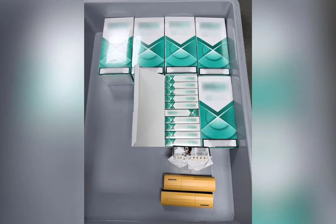 ICA officers found 2 vapes, more than 50 vape pods and more than 1,200 heat sticks in the woman's possession.