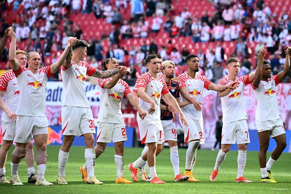 FILE PHOTO: Soccer Football - Bundesliga - RB Leipzig v VfL Wolfsburg - Red Bull Arena, Leipzig, Germany - April 13, 2024 RB Leipzig players celebrate after the match REUTERS/Annegret Hilse/File Photo
