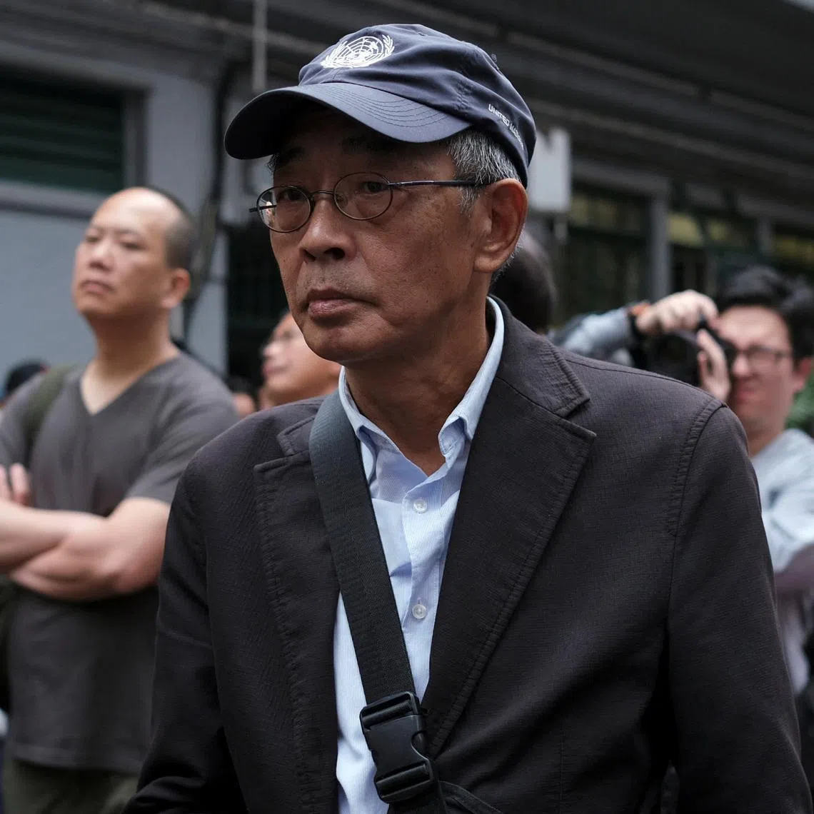 FILE PHOTO: Bookseller Lam Wing-kee marches during a protest to demand authorities scrap a proposed extradition bill with China, in Hong Kong, China March 31, 2019. REUTERS/Tyrone Siu/File Photo