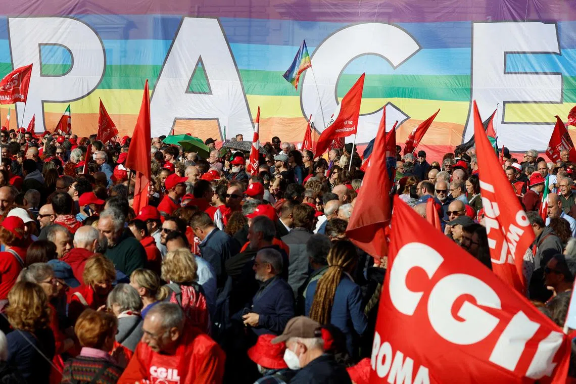 FILE PHOTO: People gather at a trade unions' demonstration in Piazza del Popolo, as Italy's main trade unions, CGIL and UIL, hold a four-hour strike against the Government's 2024 budget, in Rome, Italy November 17, 2023. REUTERS/Remo Casilli/File Photo