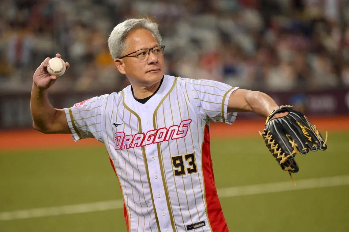 Nvidia's CEO Jensen Huang throwing a pitch during a baseball game between CTBC Brothers and Wei Dragons at the Taipei Dome in Taipei on June 1. The world's biggest AI tech and semiconductor companies will converge in Taiwan this week for Computex 2024, with Nvidia's CEO Jensen Huang to deliver his keynote speech on June 2. 
