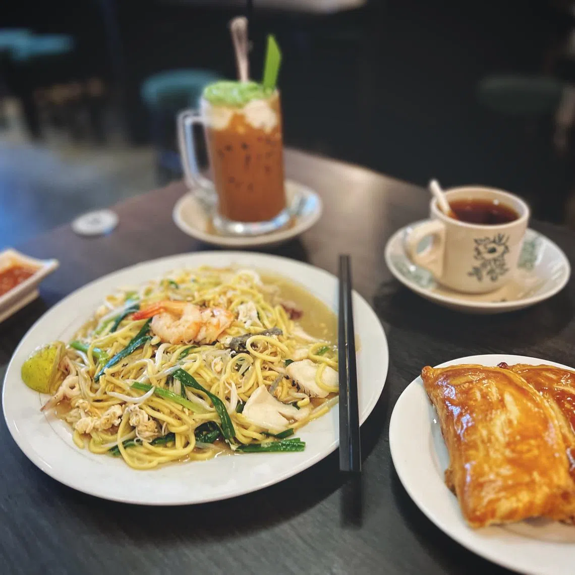 Huai Heong Kopi serves Singapore Prawn Singapore Prawn Mee (which is known as Hokkien Prawn Mee, in the Republic), along with traditional pastries filled with kaya, and coffee concoctions.