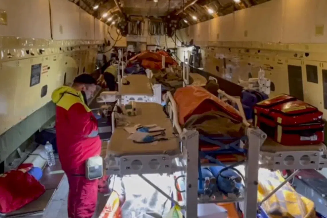 epa11793840 A still image taken from a handout video made available by the Russian Emergency Ministry Press-Service shows shows Russian rescuers preparing to unload passengers wounded in a Azerbaijan Airline plane crash in Kazakhstan, upon a medical plane arrival at Zhukovsky airport, outside Moscow, Russia, 26 December 2024. Azerbaijan Airlines Embraer ERJ-190AR passenger plane flying from Baku to Grozny crashed some three kilometres away from the Kazakh city of Aktau on 25 December. At least 29 people, including three minors, were rescued and hospitalized in medical institutions of Aktau, the Kazakhstan's Ministry for Emergency Situations said on 26 December, adding that 38 bodies were found at the site of the crash.  EPA-EFE/RUSSIAN EMERGENCIES MINISTRY HANDOUT -- MANDATORY CREDIT -- BEST QUALITY AVAILABLE -- HANDOUT EDITORIAL USE ONLY/NO SALES