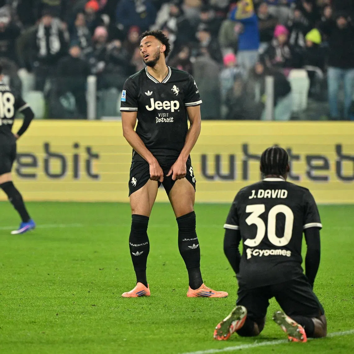 Soccer Football - Serie A - Juventus v Lecce - Allianz Stadium, Turin, Italy - January 3, 2026 Juventus' Jonathan David and Lloyd Kelly react REUTERS/Alberto Lingria