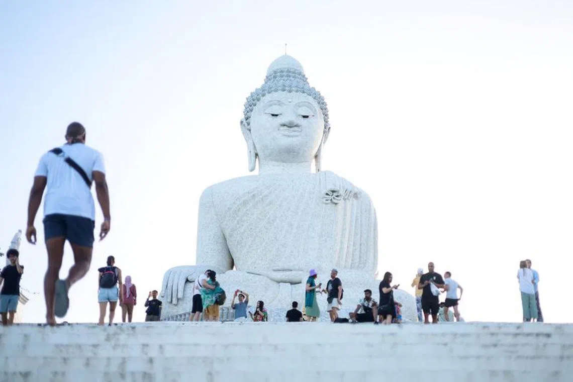 FILE PHOTO: Tourists visit the Big Buddha statue in Phuket, Thailand July 3, 2023. REUTERS/Jorge SIlva/File Photo