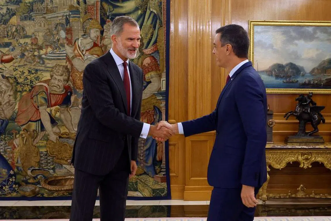 Spain's King Felipe shakes hands with Spain's acting Prime Minister Pedro Sanchez before their meeting at Zarzuela Palace in Madrid, Spain, October 3, 2023. Juanjo Guillen/Pool via REUTERS