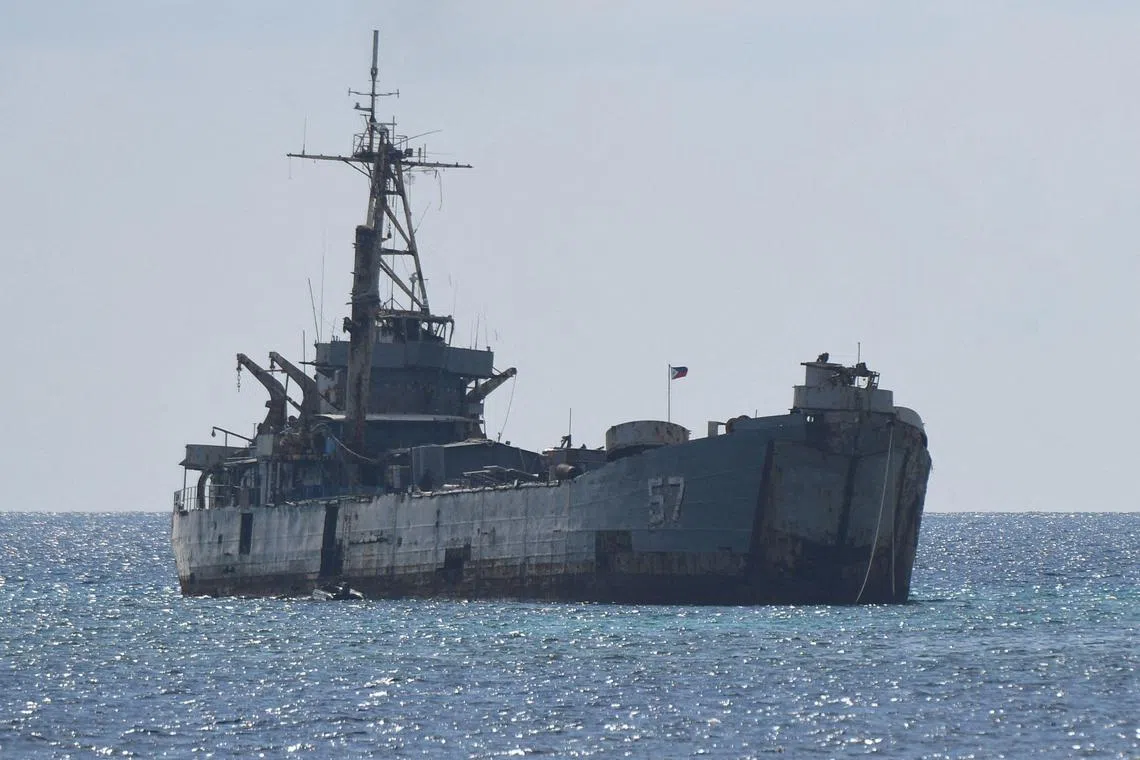 This file photo taken on April 23, 2023 shows the grounded Philippine navy ship BRP Sierra Madre where marines are stationed to assert Manila's territorial claims at Second Thomas Shoal in the Spratly Islands in the disputed South China Sea. A crumbling World War II-vintage Philippine navy vessel stranded on a submerged reef in the South China Sea has long been a flashpoint between Manila and Beijing in their territorial dispute over the waters. 