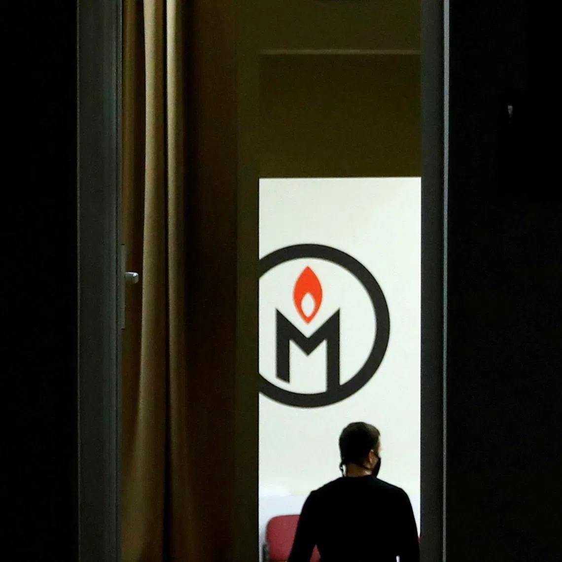 FILE PHOTO: A man walks inside an office of the human rights group Memorial in Moscow, Russia December 29, 2021. Picture taken December 29, 2021. REUTERS/Evgenia Novozhenina/File Photo