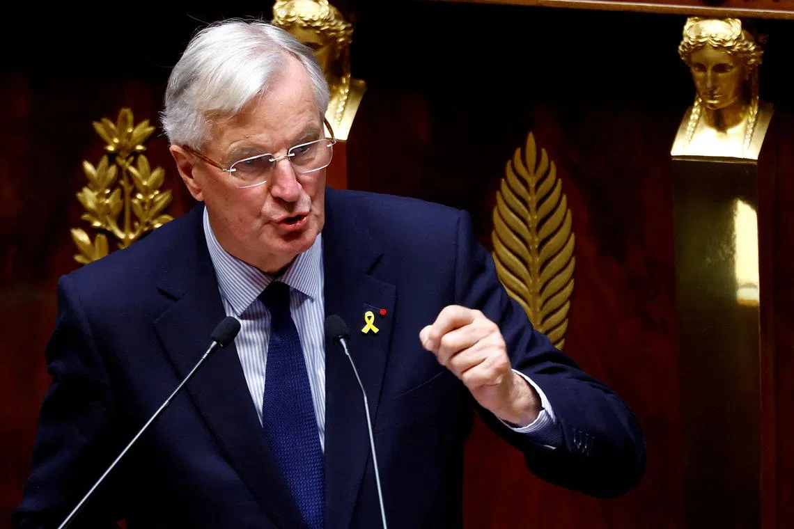 FILE PHOTO: French Prime Minister Michel Barnier delivers a speech during a censure motion debate filed by the alliance of left-wing parties the \"Nouveau Front Populaire\" (New Popular Front - NFP), after the questions to the government session at the National Assembly in Paris, France, October 8, 2024. REUTERS/Stephanie Lecocq/File Photo