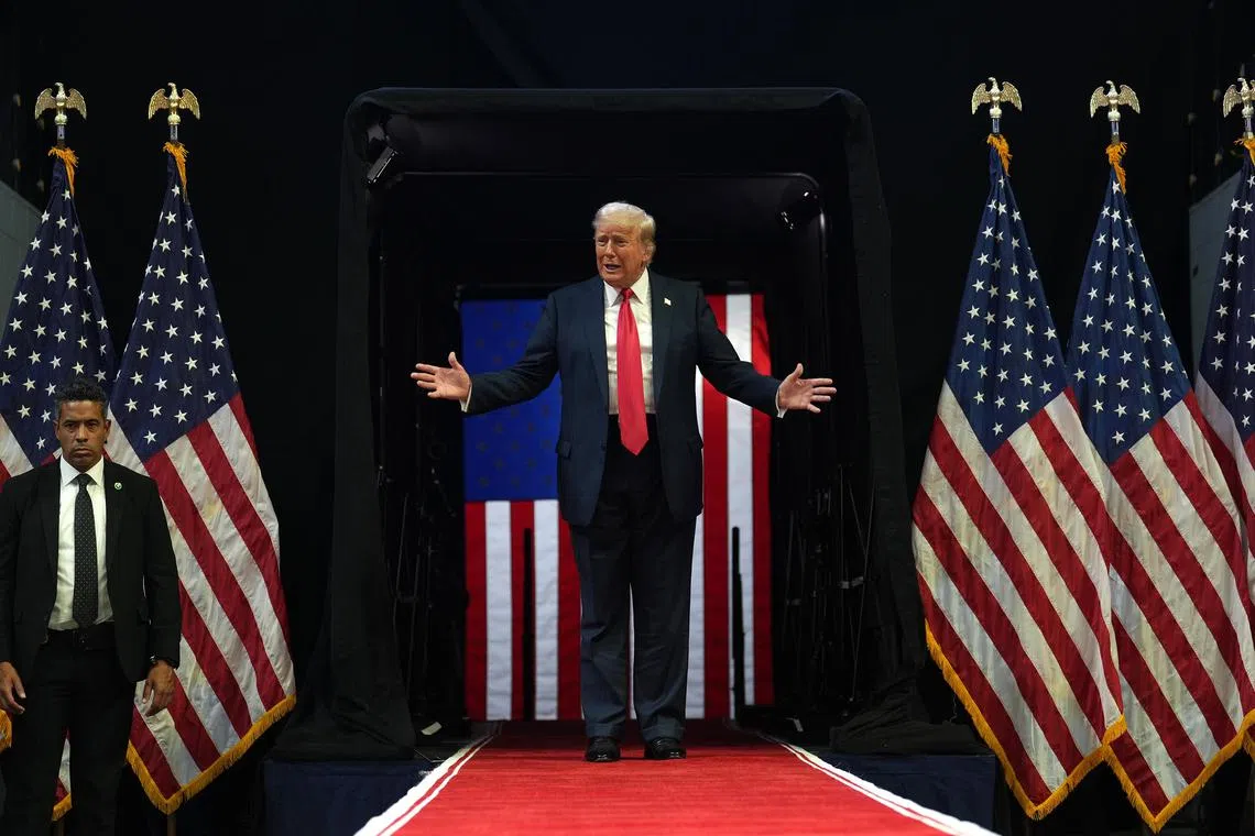Former President Donald Trump takes the stage for a campaign rally at the Van Andel Arena in Grand Rapids, Michigan on July 20. 