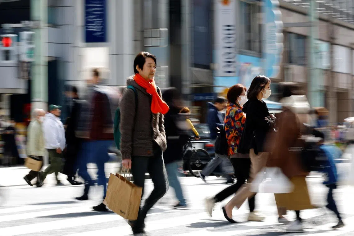 Shoppers make their way at a shopping district in Tokyo, Japan March 19, 2024. REUTERS/Kim Kyung-Hoon