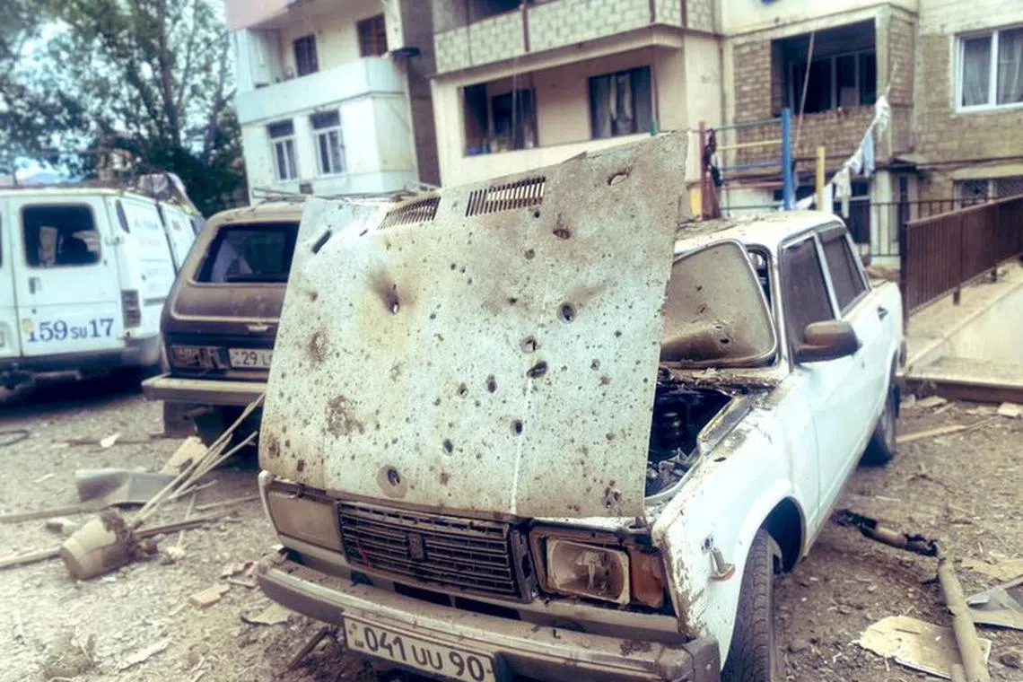 A view shows damaged cars in front of a residential building following the launch of a military operation by Azerbaijani armed forces in the city of Stepanakert in Nagorno-Karabakh, a region inhabited by ethnic Armenians, September 19, 2023. Siranush Sargsyan/PAN Photo via REUTERS/File Photo