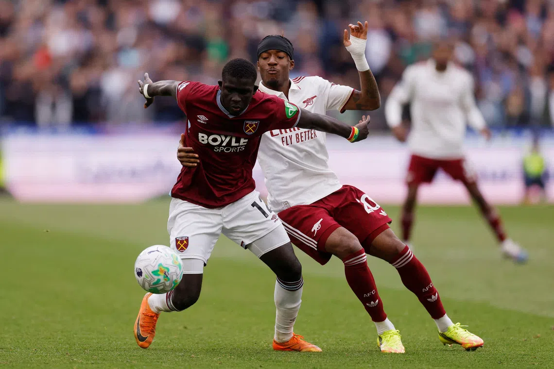 FILE PHOTO: Soccer Football - Premier League - West Ham United v Arsenal - London Stadium, London, Britain - May 10, 2026 West Ham United's El Hadji Malick Diouf in action with Arsenal's Noni Madueke Action Images via Reuters/Andrew Couldridge
