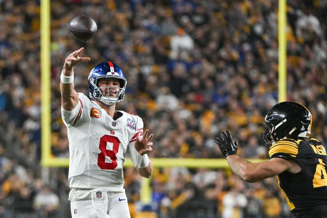 Oct 28, 2024; Pittsburgh, Pennsylvania, USA; New York Giants quarterback Daniel Jones (8) throws pass in front of Pittsburgh Steelers linebacker Payton Wilson (41) during the second quarter at Acrisure Stadium. Mandatory Credit: Barry Reeger-Imagn Images