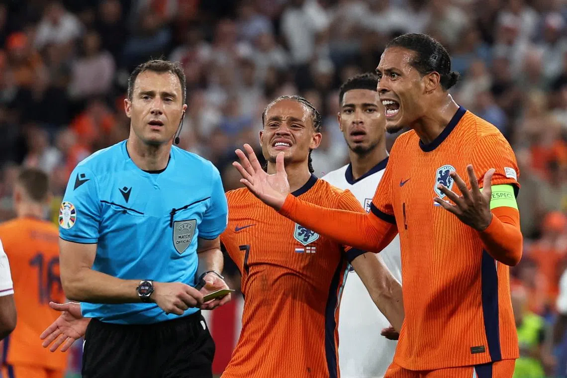 Soccer Football - Euro 2024 - Semi Final - Netherlands v England - Dortmund BVB Stadion, Dortmund, Germany - July 10, 2024  Netherlands' Virgil van Dijk reacts as referee Felix Zwayer looks on REUTERS/Lee Smith     TPX IMAGES OF THE DAY