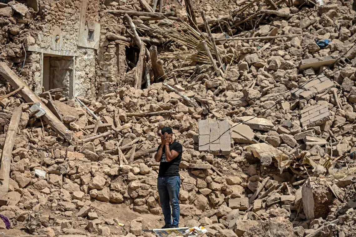 A volunteer reacting amid the rubble of destroyed houses in the village of Douzrou on Sept 12. following a 6.8-magnitude quake. Hopes dimmed in Morocco's search for survivors, four days after a powerful earthquake killed more than 2,800 people, most of them in remote villages of the High Atlas Mountains. 