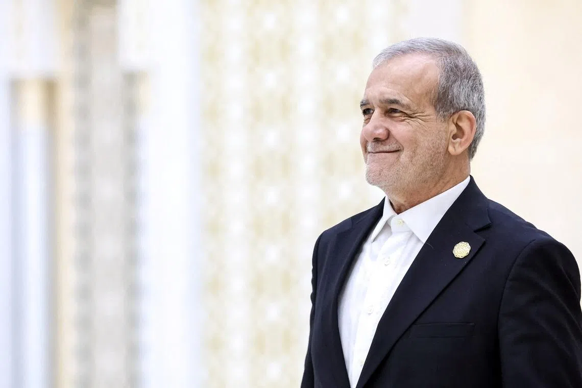 Iranian President Masoud Pezeshkian arrives to attend a plenary session of the International Forum dedicated to the International Year of Peace and Trust, the International Day of Neutrality, and the 30th anniversary of Turkmenistan's neutrality status, at the Congress Centre in Ashgabat, Turkmenistan December 12, 2025. Sputnik/Alexander Kazakov/Pool via REUTERS