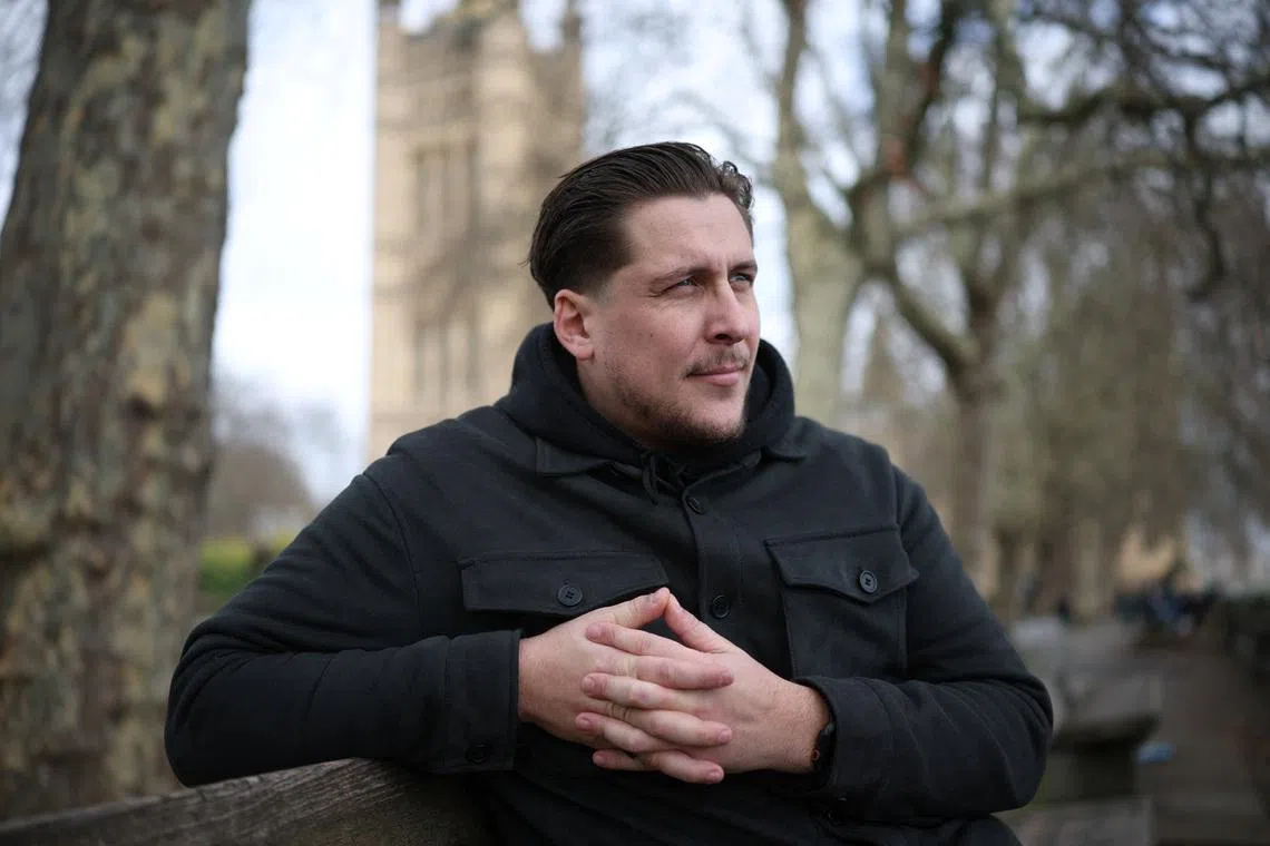 FILE PHOTO: Joe Bennett, son of British citizen Lindsay Foreman, who has been imprisoned in Iran and sentenced for 10 years with her husband Craig, following their arrest on espionage charges during a round-the-world motorcycle trip in January 2025, poses for a photograph during an interview with Reuters in London, Britain March 3, 2026. REUTERS/Isabel Infantes/File Photo