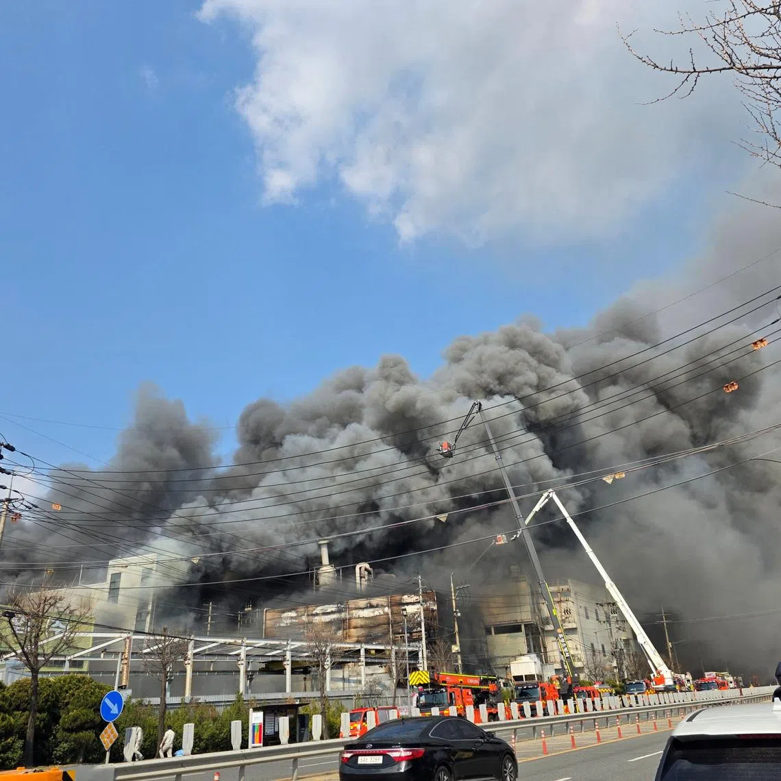 Firefighters were struggling to contain the fire as one of the two buildings affected had collapsed.
