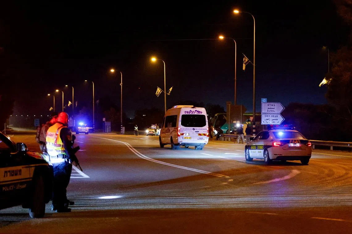 A bus carrying hostages released as part of a deal between Israel and Hamas, drives by in Urim, Israel, on Nov 29.