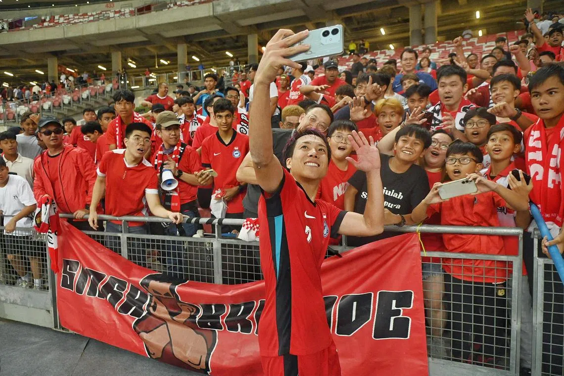 Singapore midfielder Kyoga Nakamura taking a wefie with  Lions supporters after the 
